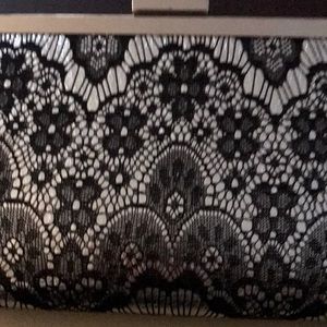 NWT. Black and silver clutch